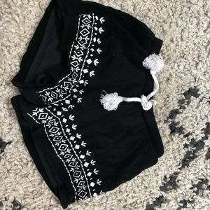 black and white beach shorts with frills stretches